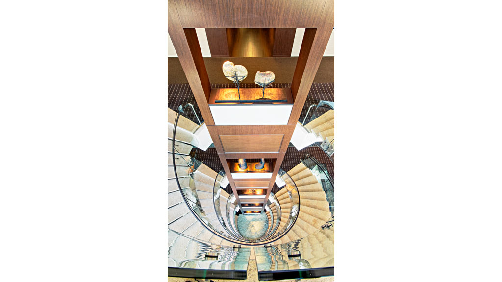 A spiral staircase with a lamp.