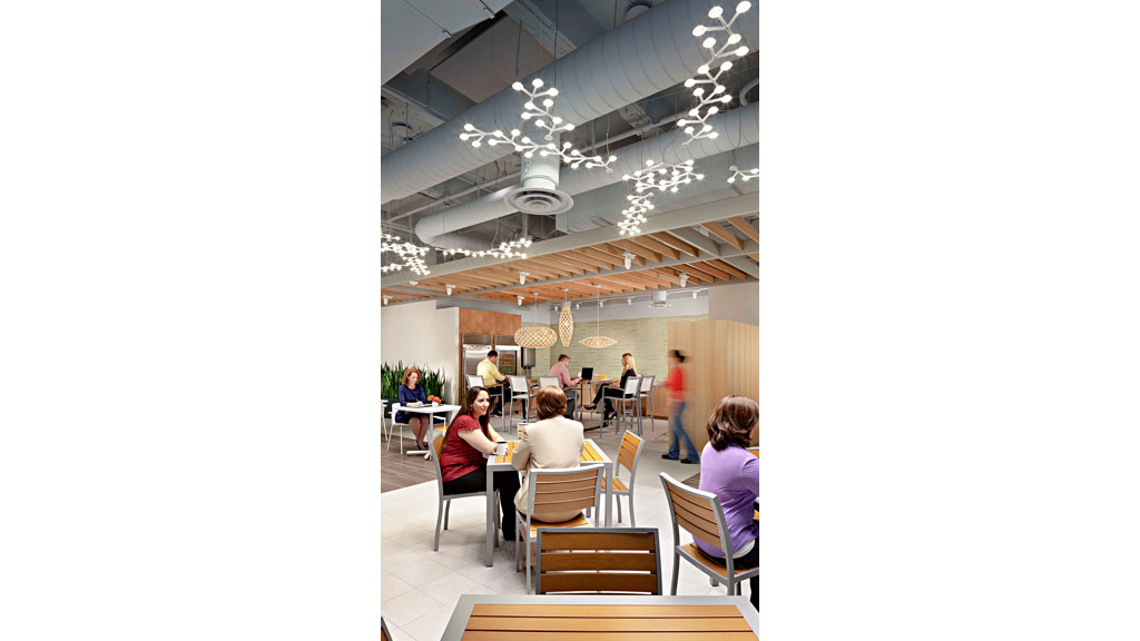 People sitting at tables in a room.