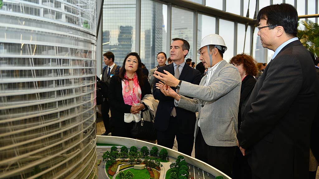 A group of people standing outside.