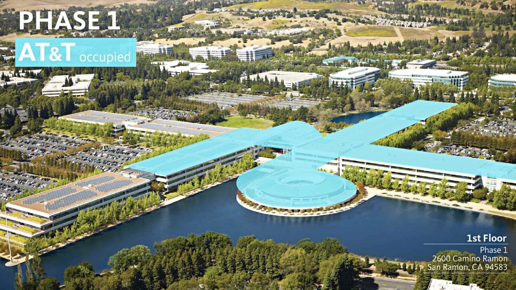 A large building next to a body of water.