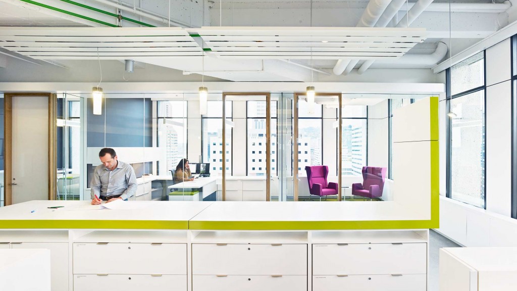 A person standing behind a counter.