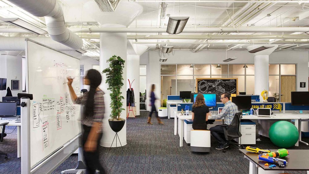 A person writing on a white board.