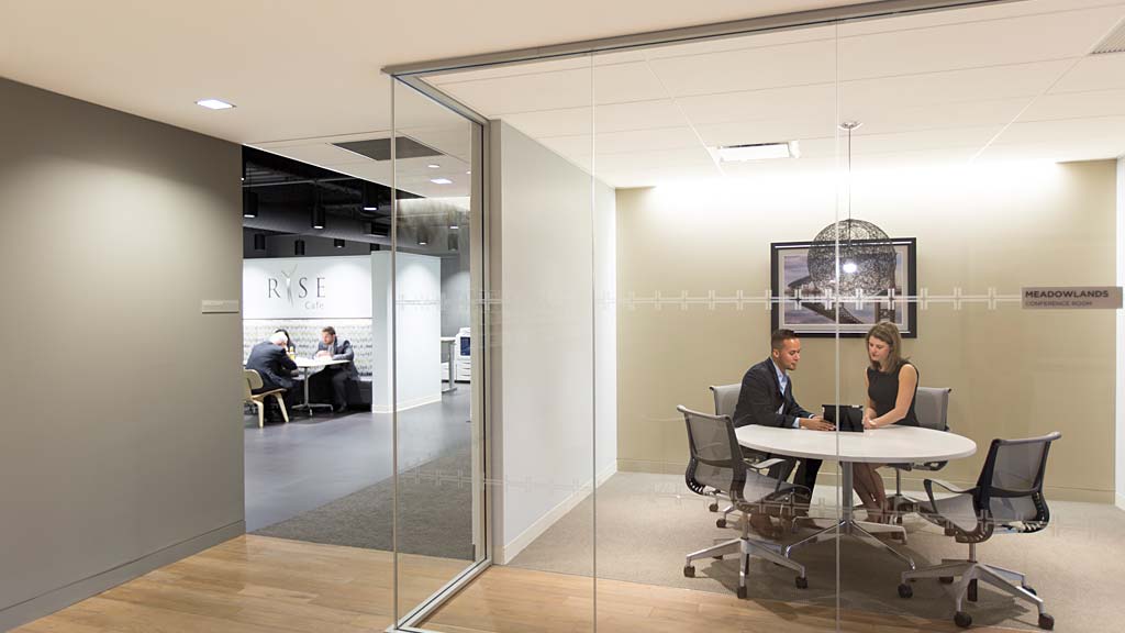 A group of people sitting at a table in a room.