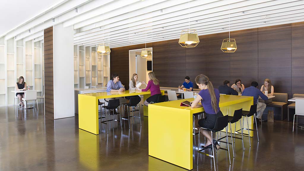 A group of people sitting at tables.