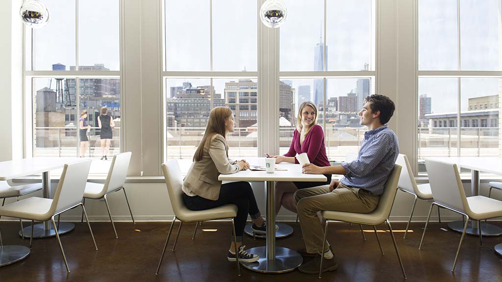 A group of people sitting around a table.