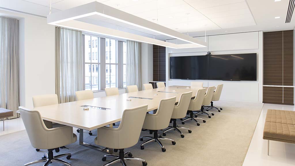 A room with a table and chairs.