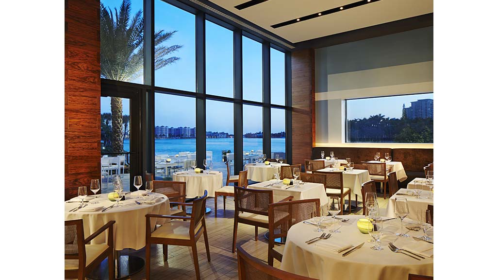 A room with tables and chairs.