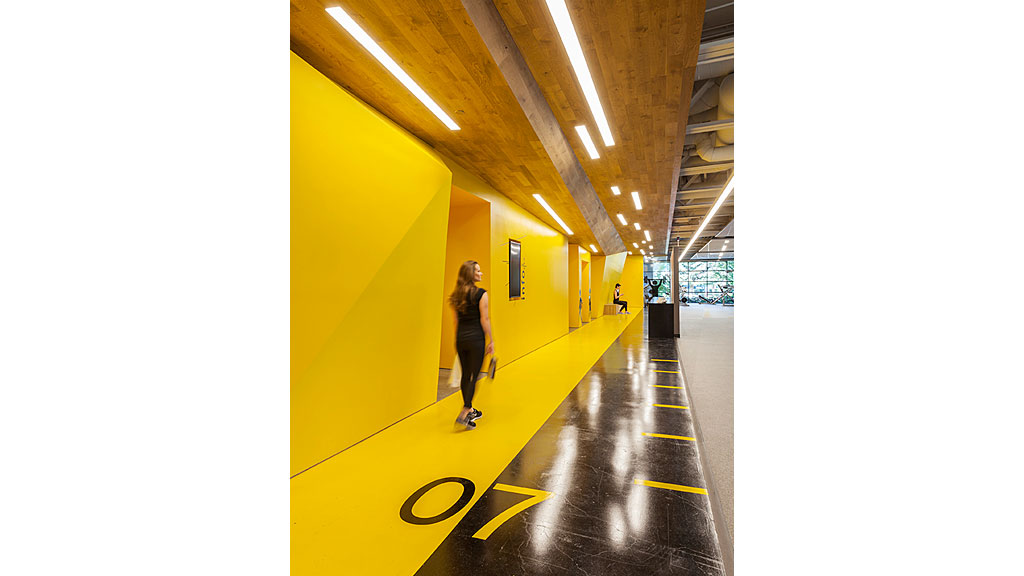 A person standing in a hallway.