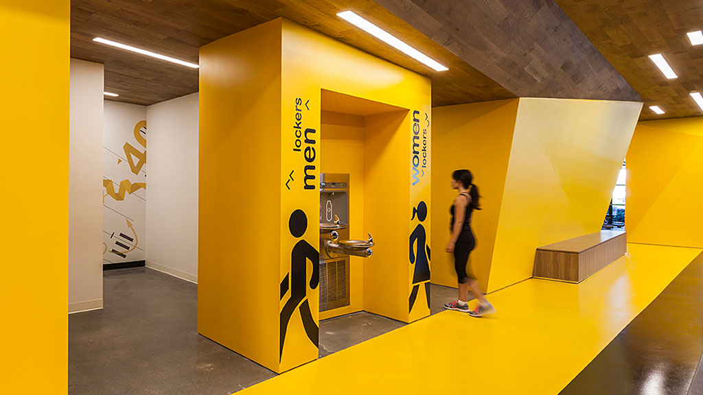 A person standing in a hallway.