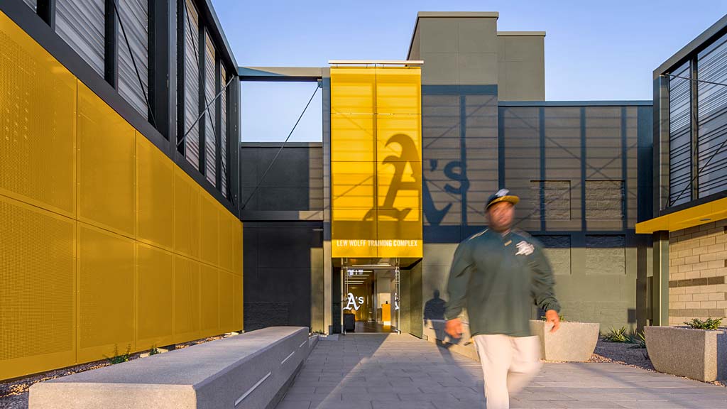 A person walking outside of a building.