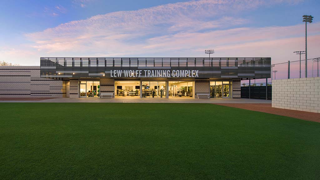 A building with a grass field.