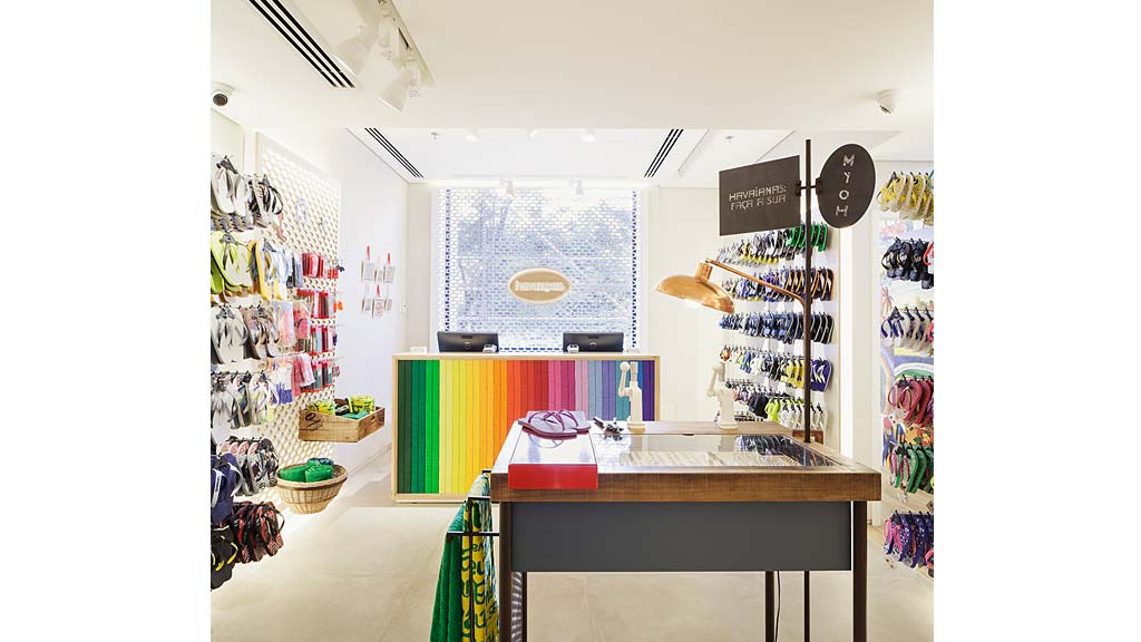 A room with a desk and shelves.