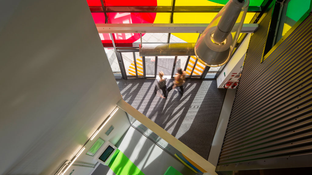 People walking down a flight of stairs.