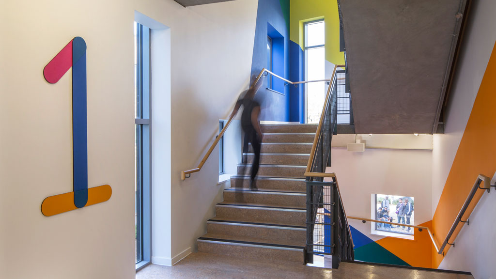 A person walking up a flight of stairs.
