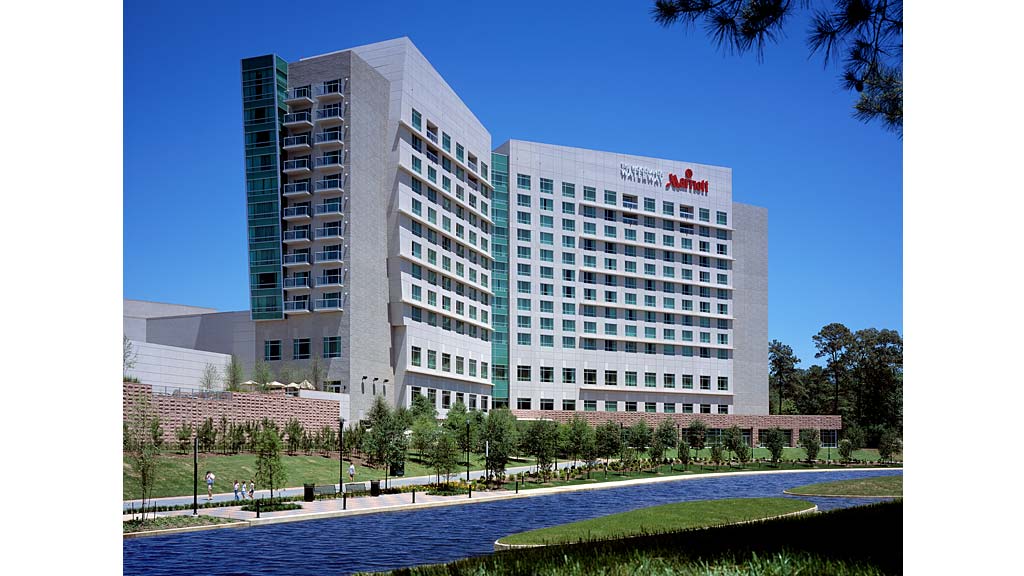 A building with a green lawn.