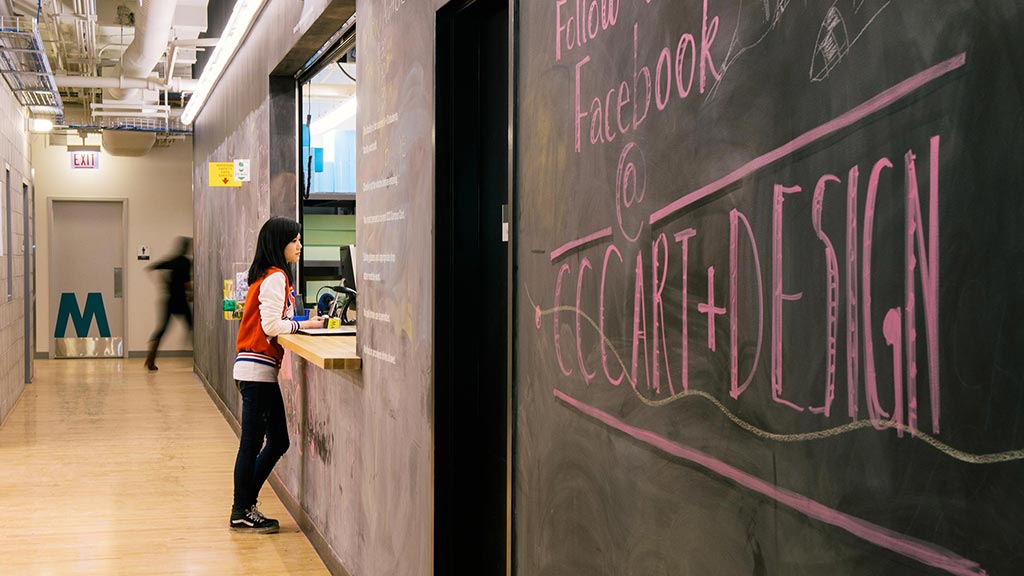 A person standing in a hallway.