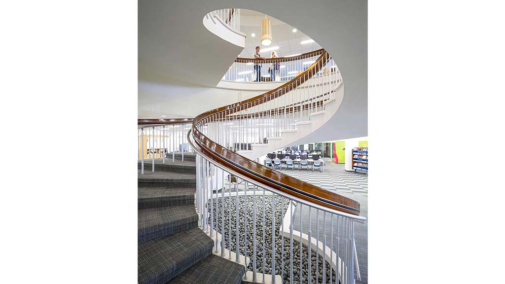 A staircase with a railing.