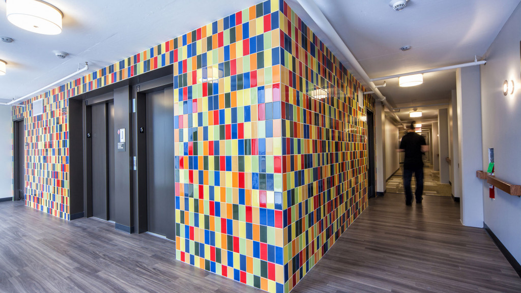 A person walking down a hallway.