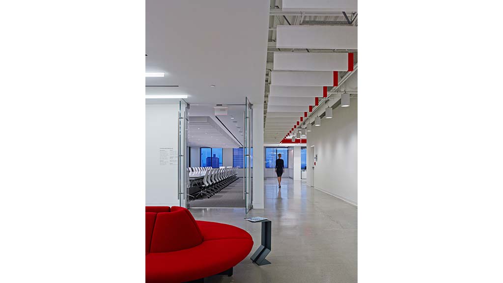 A person walking down a hall.