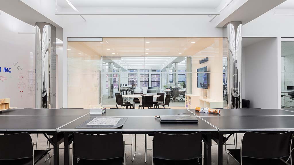 A large room with a large table and chairs.