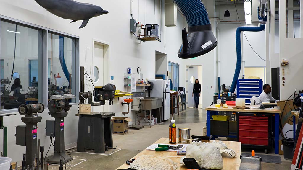 A room with a few people and equipment.