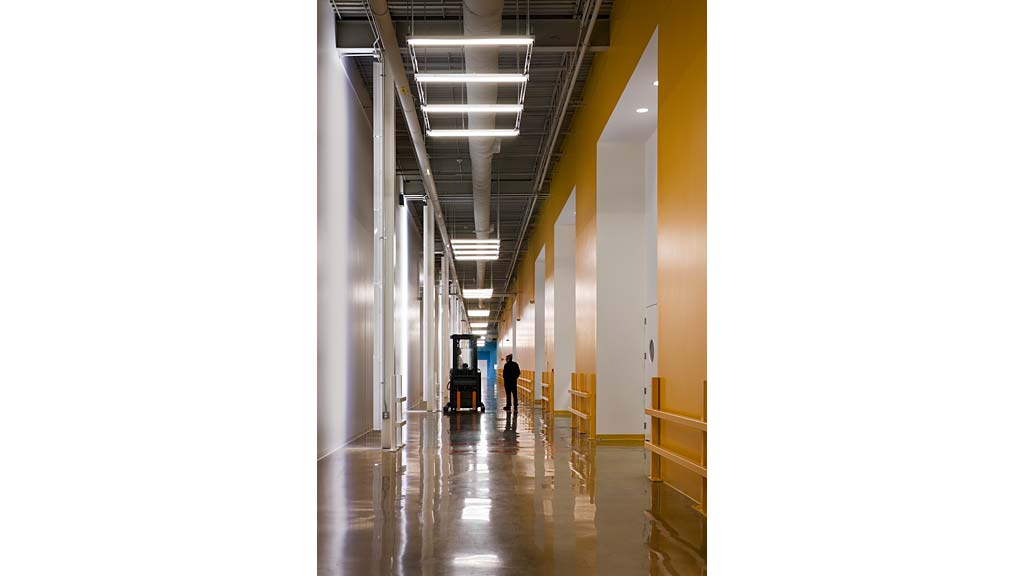 A person walking down a hall.