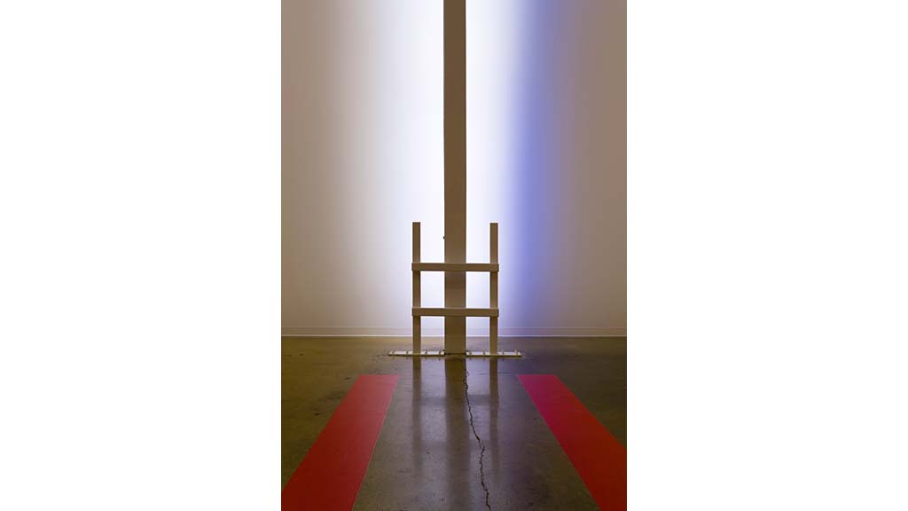 A wooden chair in a room.