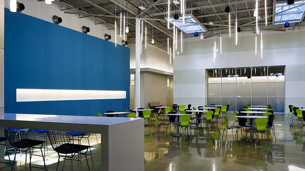 A room with tables and chairs.