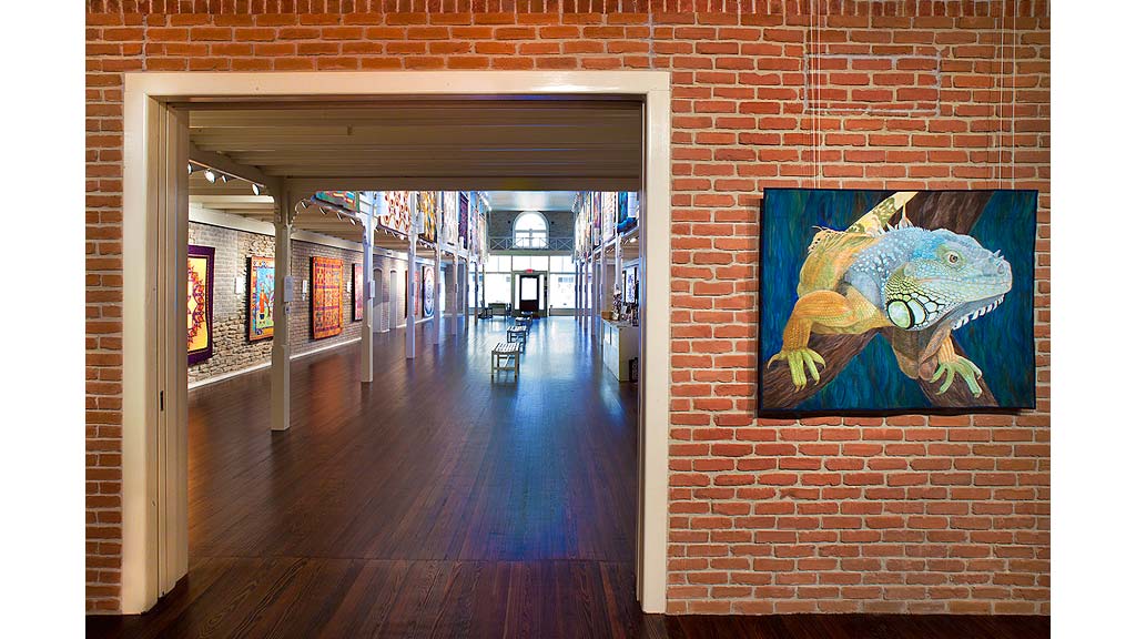 A hallway with a painting on the wall.