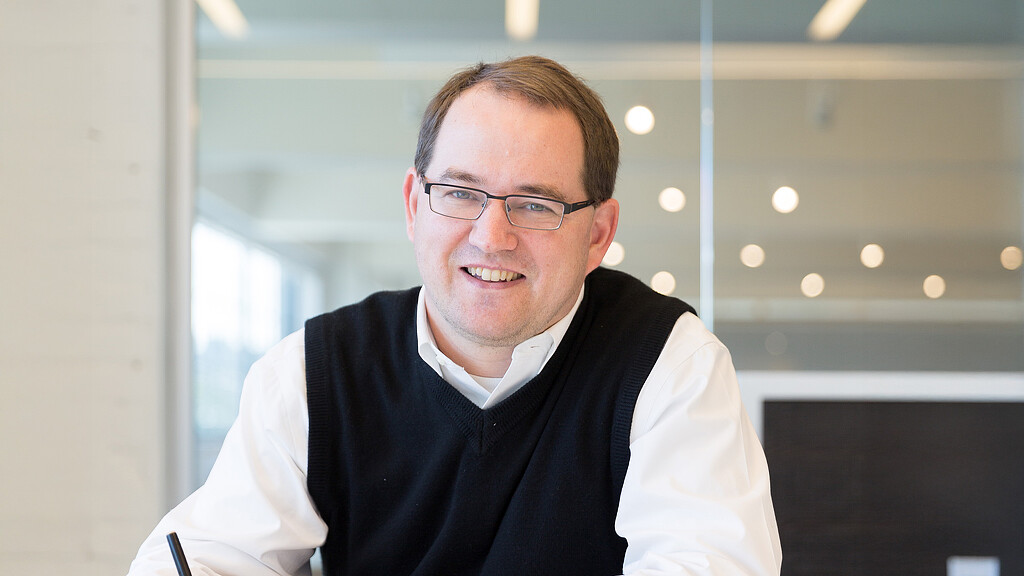 A man wearing glasses.