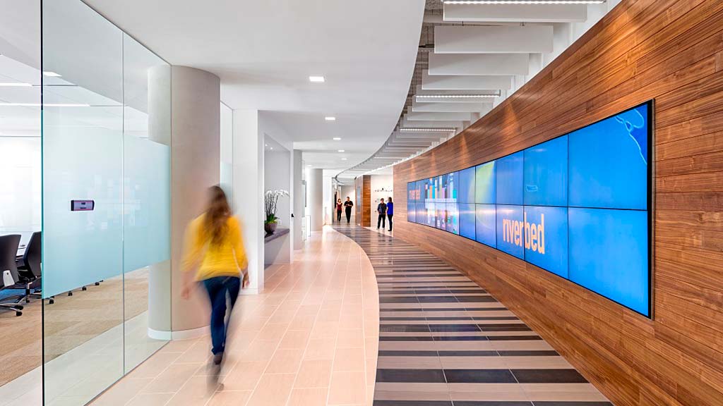 A person walking in a hallway.