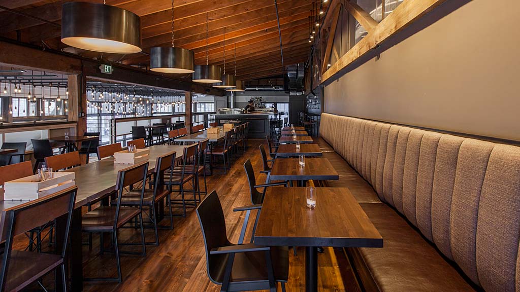 A restaurant with tables and chairs.