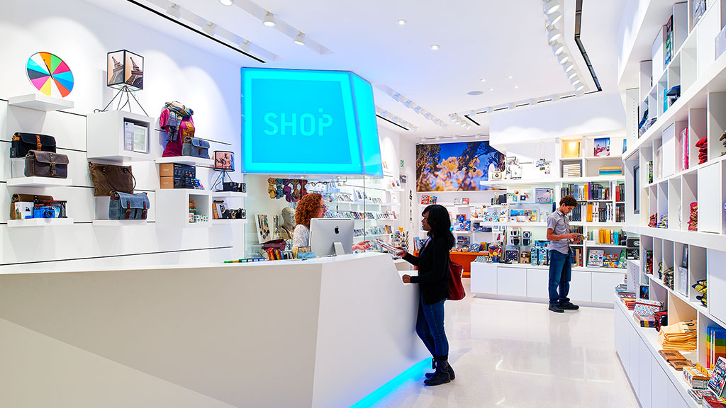 A few people in a library.