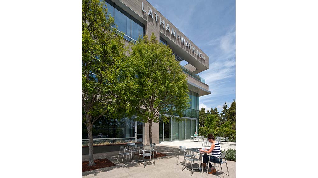 A person sitting outside a building.