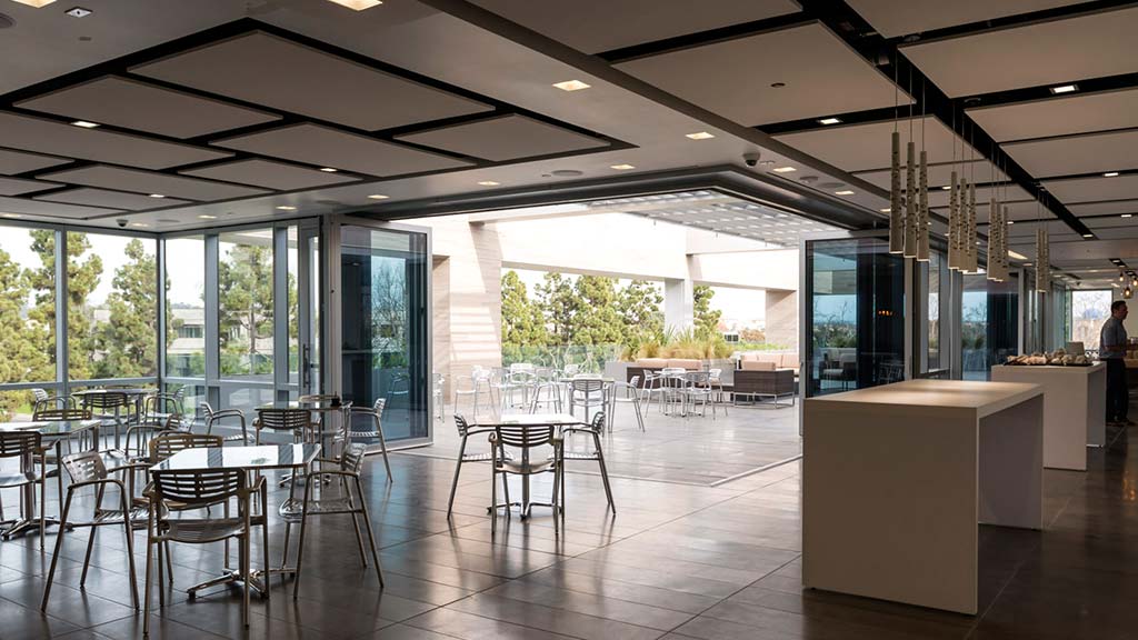 A large room with tables and chairs.