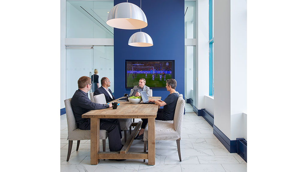 A group of people sitting around a table.