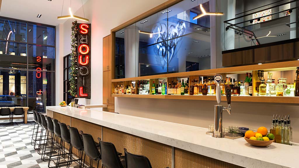 A bar with chairs and tables.
