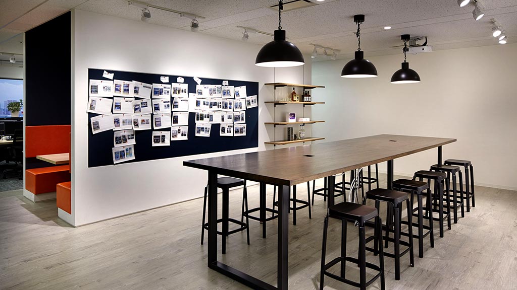 A room with a table and chairs.