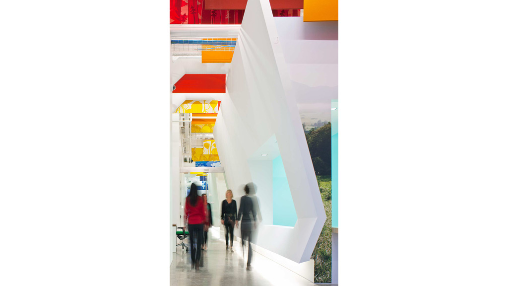 A group of people walking through a building.
