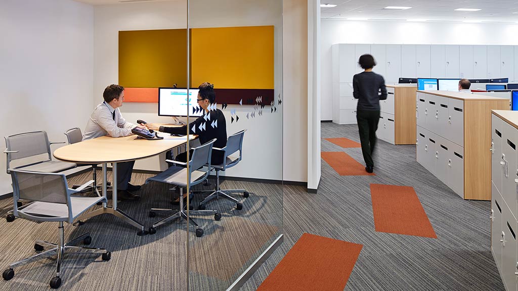 A group of people in an office.