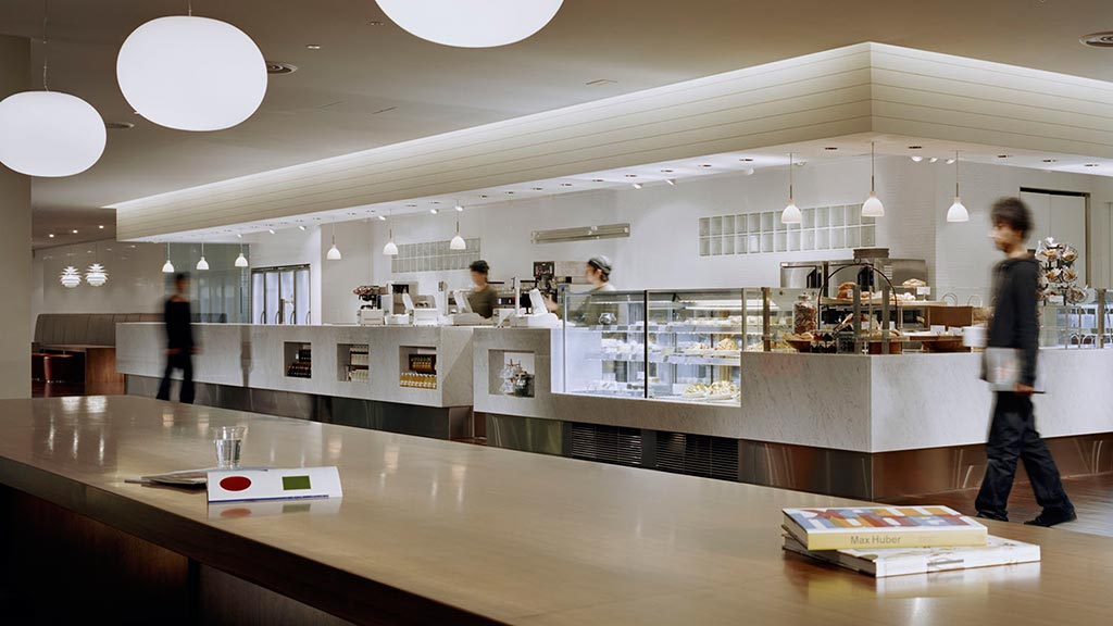 A person standing in a large room.