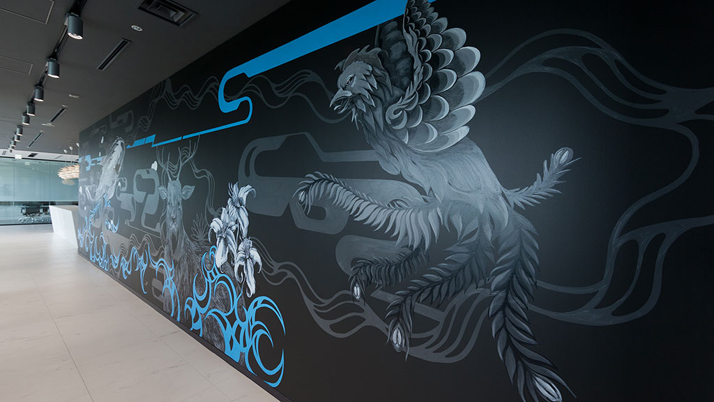 A wall with a mural of a person with a sword.