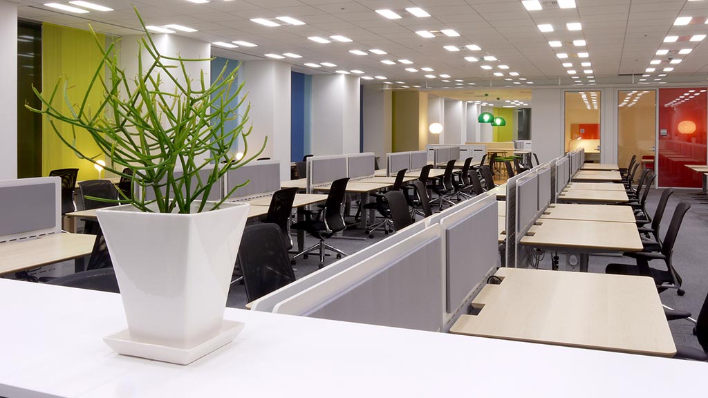 A room with tables and chairs.