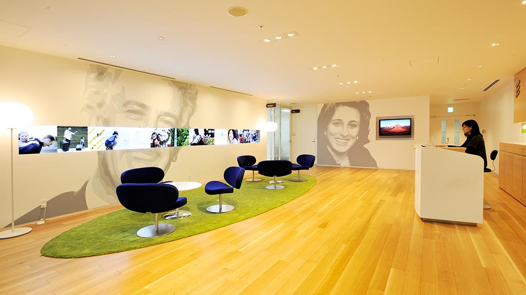 A room with a large painting on the wall.