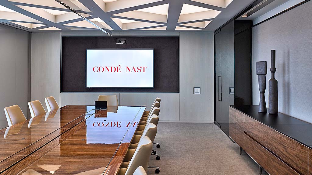 A conference room with a large screen.