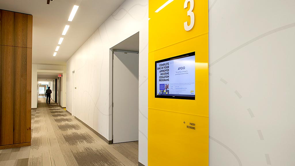 A hallway with a sign on the wall.