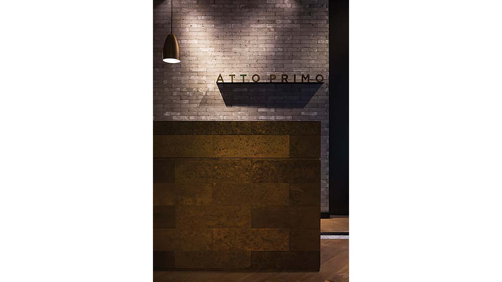 A brick wall with a sign on it.