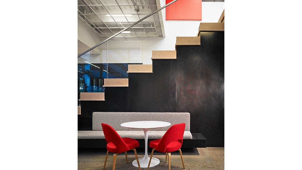 A table and chairs in a room.