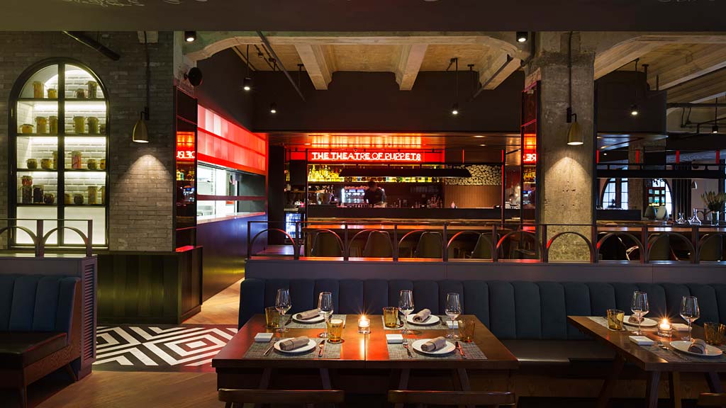 A restaurant with tables and chairs.