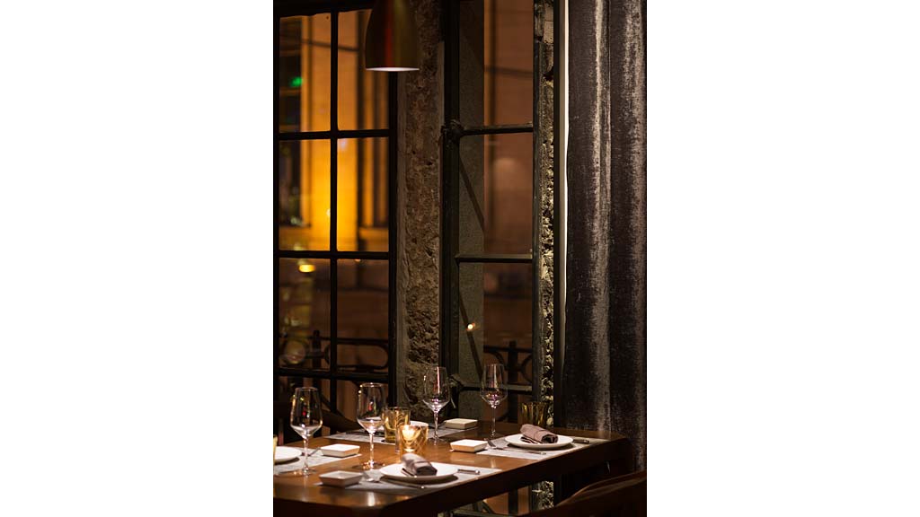 A table with glasses and plates on it.